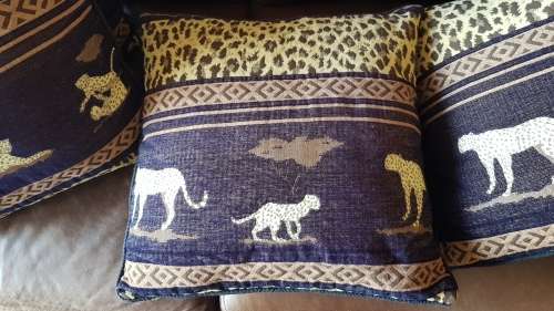 Vintage Scatter cushion:  Leopards on Brown background, with a broad African print at the top.