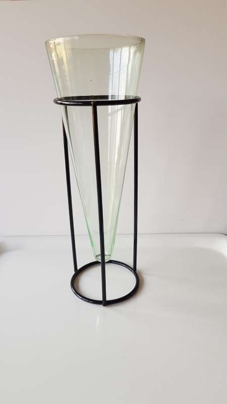 Glass Flower vase. Large glass vase, funnel shaped and mounted on smooth round wrought iron base.