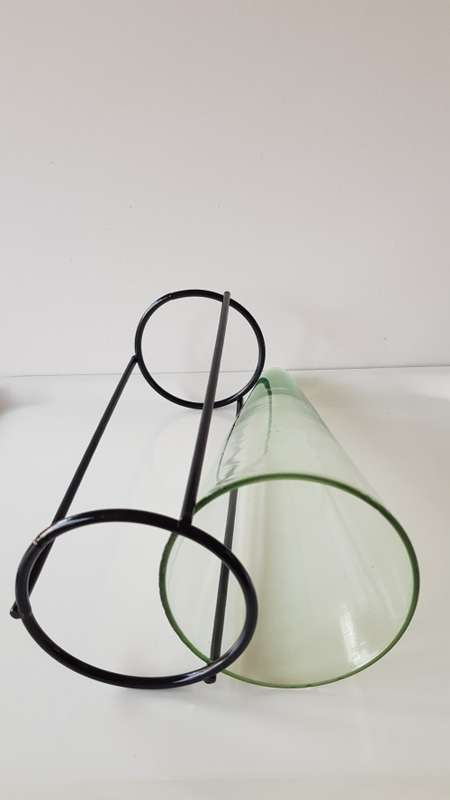 Glass Flower vase. Large glass vase, funnel shaped and mounted on smooth round wrought iron base.