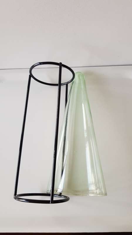 Glass Flower vase. Large glass vase, funnel shaped and mounted on smooth round wrought iron base.