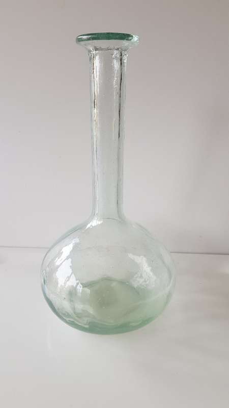 Glass Flower vase. Long thin necked glass vase with round base. Glass has small air bubbles.