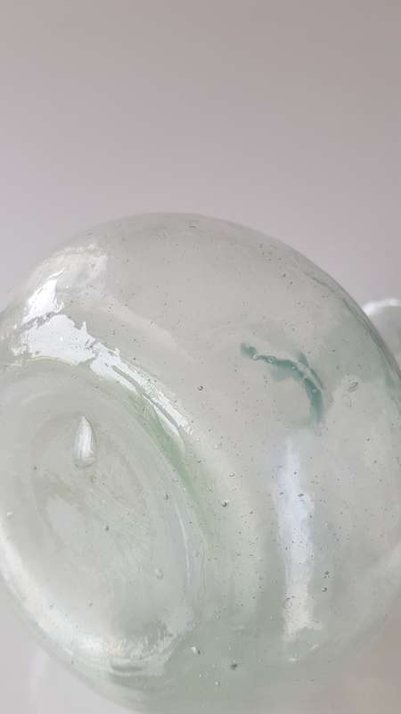 Glass Flower vase. Long thin necked glass vase with round base. Glass has small air bubbles.