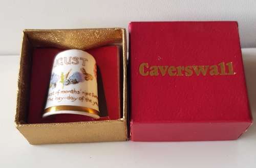 A Caverswall Fine Bone China collectors thimble in original presentation box.