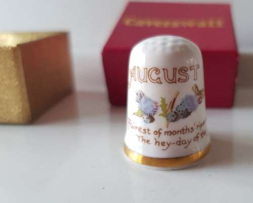 A Caverswall Fine Bone China collectors thimble in original presentation box.