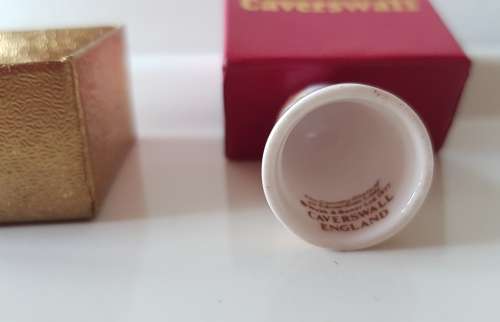 A Caverswall Fine Bone China collectors thimble in original presentation box.