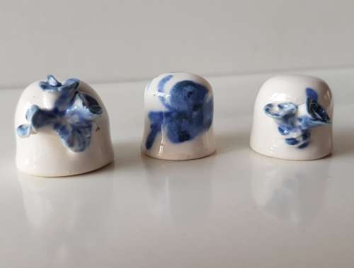 A Vintage set of 3x handmade thimble like cups. Set of three white ceramic Thimble
