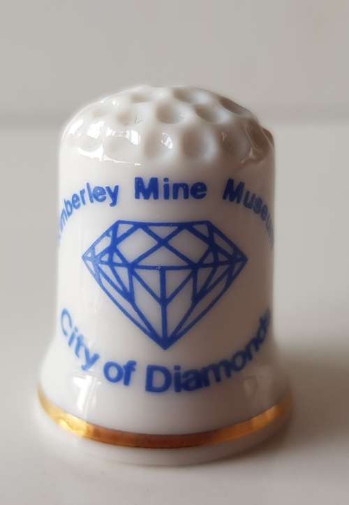 A Vintage souvenir collectors thimble. A porcelain Thimble marked Kimberley Mine Museum