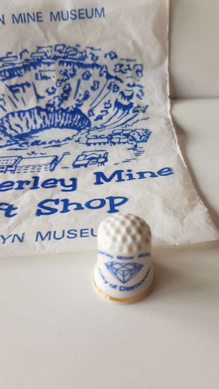 A Vintage souvenir collectors thimble. A porcelain Thimble marked Kimberley Mine Museum