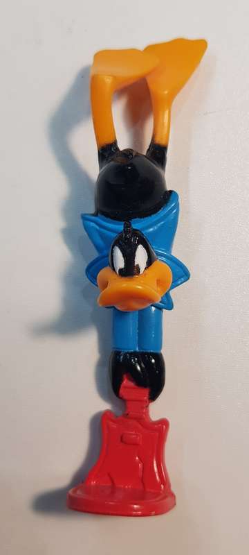 Vintage Warner Bros. Cartoon characters: Daffy Duck smashing a guitar. PVC figure