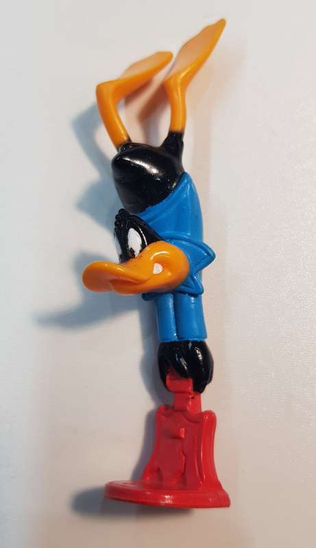 Vintage Warner Bros. Cartoon characters: Daffy Duck smashing a guitar. PVC figure