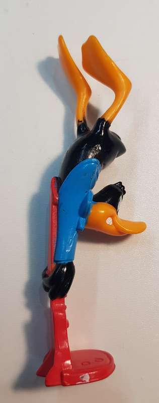 Vintage Warner Bros. Cartoon characters: Daffy Duck smashing a guitar. PVC figure
