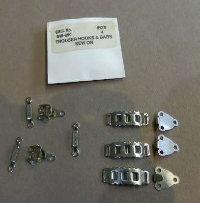 Dressmaking  Unused hook and bar fastenings for trousers or skirts.
