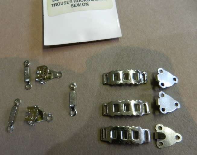 Dressmaking  Unused hook and bar fastenings for trousers or skirts.