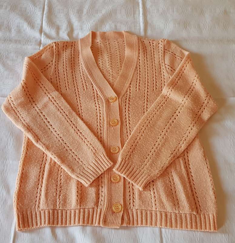 Ladies Peach Cardigan  Decorative stitch with five buttons. Machine knitted.