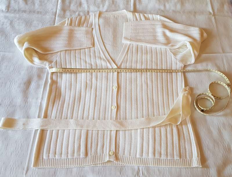 Ladies White Cardigan  Ribbed stitch with five buttons and loose belt. Machine knitted.