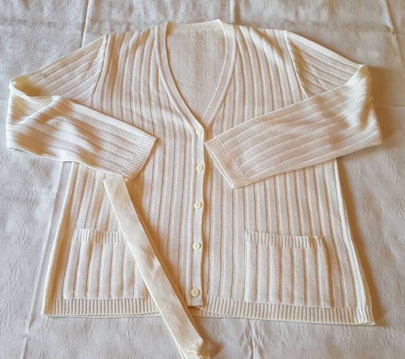 Ladies White Cardigan  Ribbed stitch with five buttons and loose belt. Machine knitted.