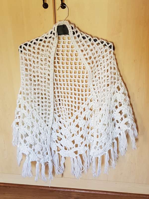 Ladies White Crouchet Poncho type shawl with tassels.