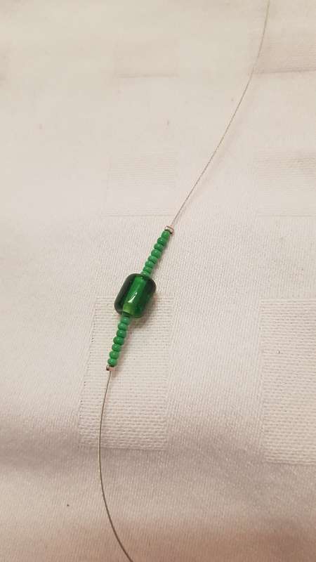 Vintage Costume Jewellery:  Wire necklace strung with green glass and African beads.