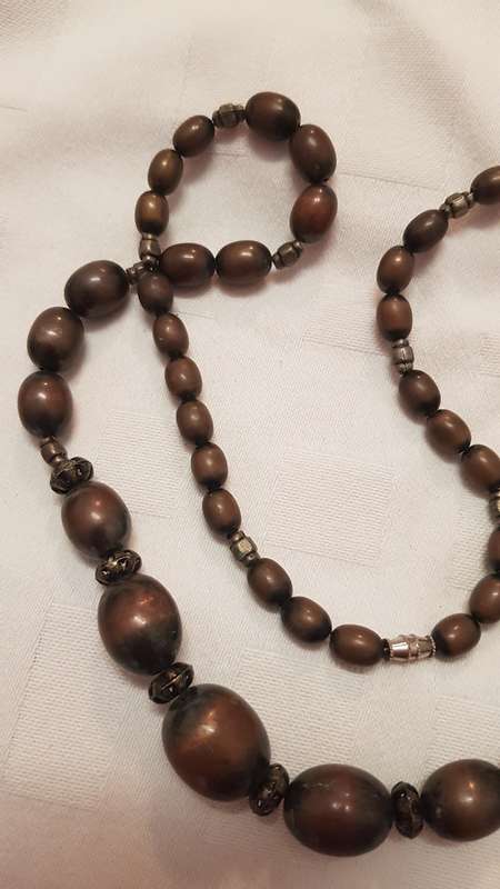 Vintage Costume Jewellery:  Necklace strung with brown plastic beads. Little girls dress-up type
