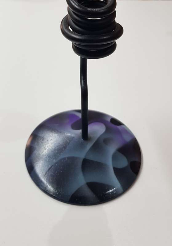 Desk standing clock, twisted iron with coloured base and a CD disc clock face.