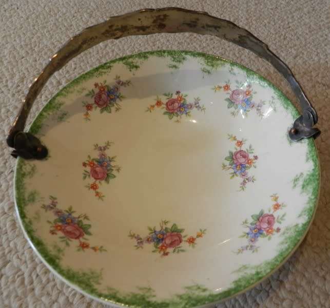 Antique Biscuit/Bon Bon Dish. Hand painted in Holland.  Porcelain floral design, silver handle