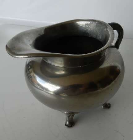 Antique Milk jug. Silver plated with mark reading  giftvrij Tiel Holland