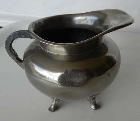 Antique Milk jug. Silver plated with mark reading  giftvrij Tiel Holland