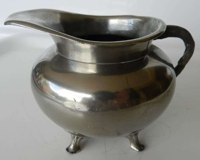 Antique Milk jug. Silver plated with mark reading  giftvrij Tiel Holland