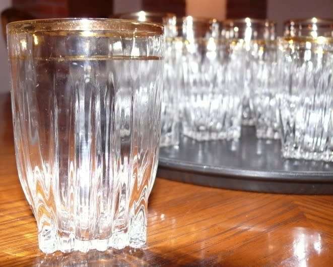 Vintage Heavy Bottom Type pressed glass drinking glasses with hand painted Gold Rim.  Circa 1960s.