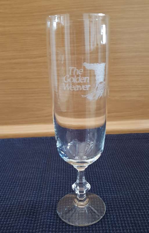 Glass: 1x Stemmed Champagne flute etched with name the Golden Weaver.
