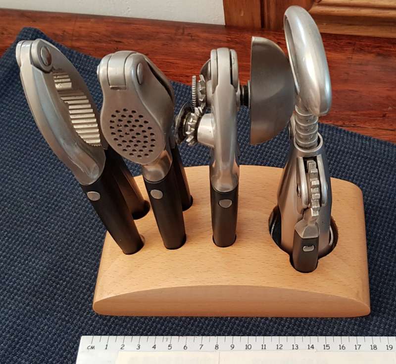 Bar/Kitchen opener set on wooden base.