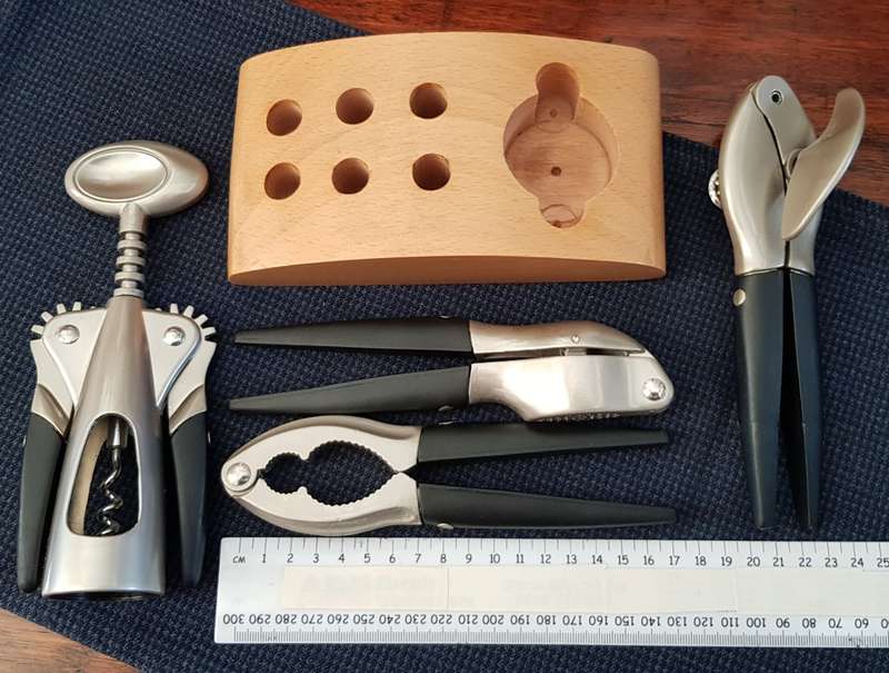 Bar/Kitchen opener set on wooden base.