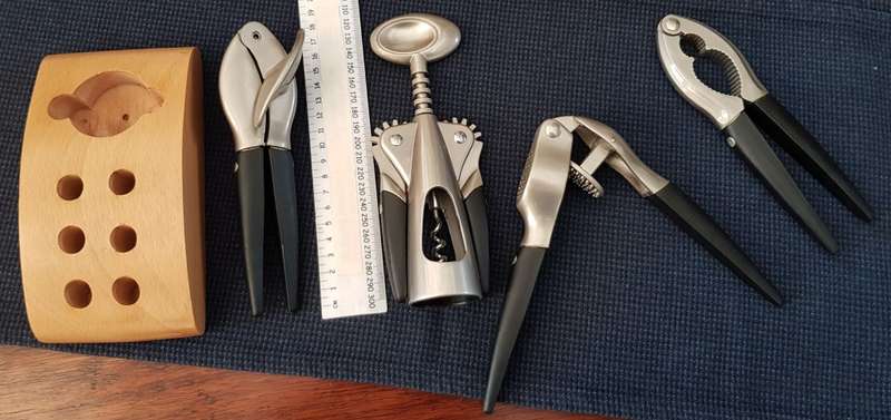 Bar/Kitchen opener set on wooden base.