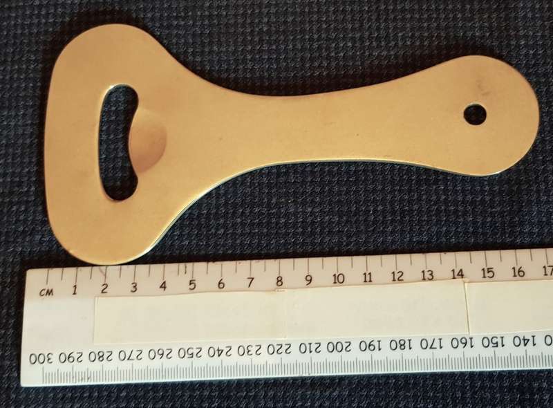 Metal solid bottle opener. Dates to 1980s.