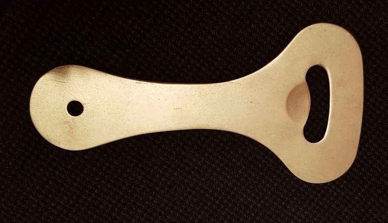 Metal solid bottle opener. Dates to 1980s.