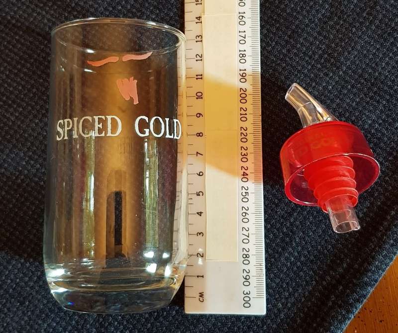 Plastic Bottle Optic pourer marked Original Spiced Gold and glass with brand name Spiced Gold.