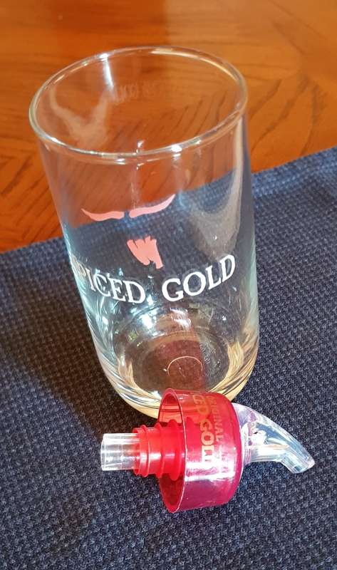 Plastic Bottle Optic pourer marked Original Spiced Gold and glass with brand name Spiced Gold.