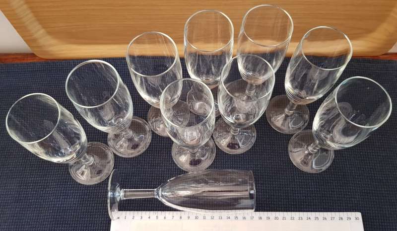 Glasses: Set of 10x Stemmed Champagne flutes in plain glass.