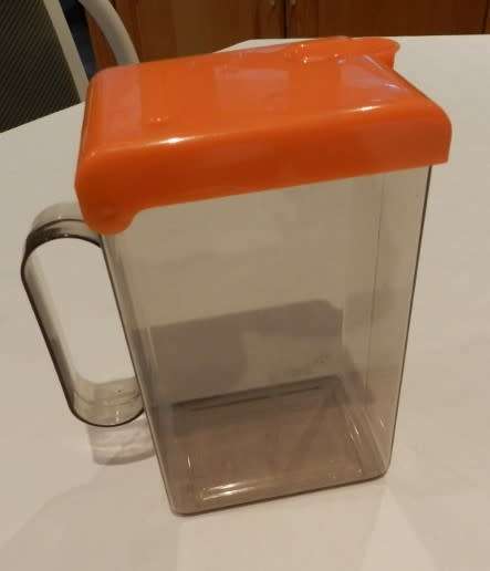 Vintage Plastic Milk or fruit juice carton container/pourer. Orange flip lid with spout and handle.