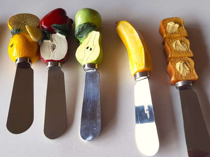 Collectable set of novelty hand painted resin and porcelain handled Cheese/butter spreader knives