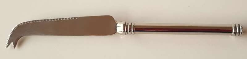 Vintage stainless steel cheese knife. An elegant cheese knife with cutting edge