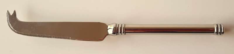 Vintage stainless steel cheese knife. An elegant cheese knife with cutting edge