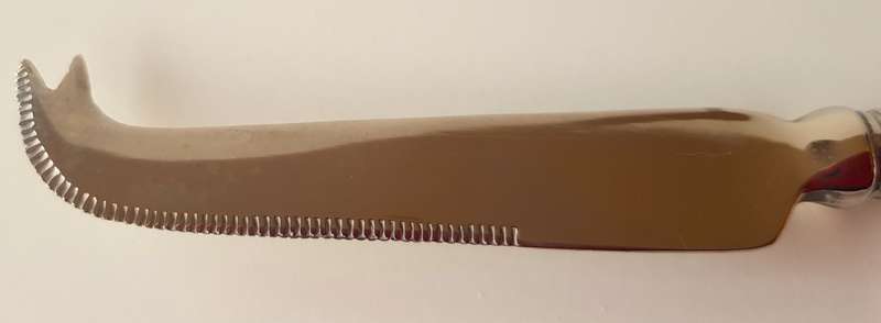 Vintage stainless steel cheese knife. An elegant cheese knife with cutting edge