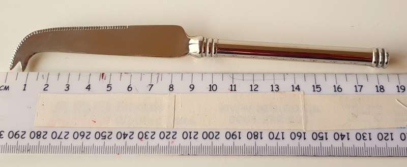 Vintage stainless steel cheese knife. An elegant cheese knife with cutting edge