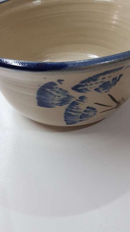 Vintage Handmade pottery bowl.   Grey shaded pottery with hand painted blue flower.