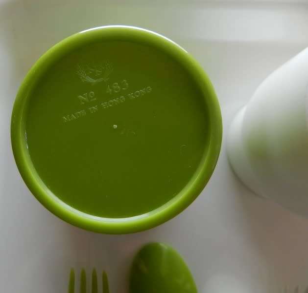 Plastic Picnic cutlery and tumbler set in four colours. White, green, tan and orange.