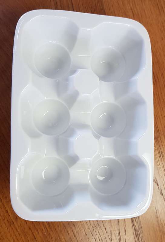 White Novelty porcelain egg holder. Takes 6x Jumbo size eggs.