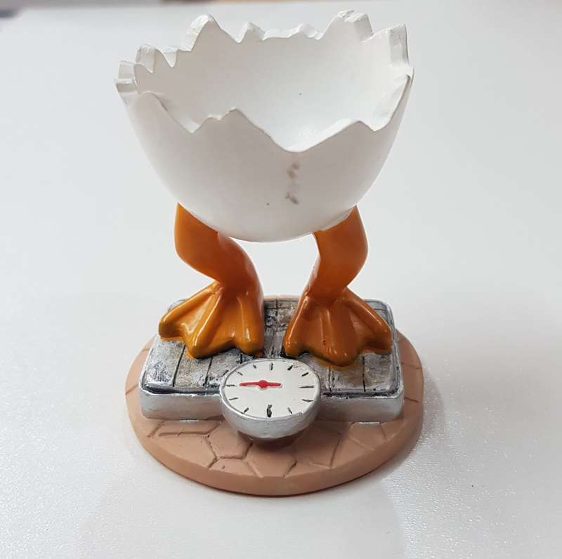 Novelty Resin egg cup  Chick standing on scale.