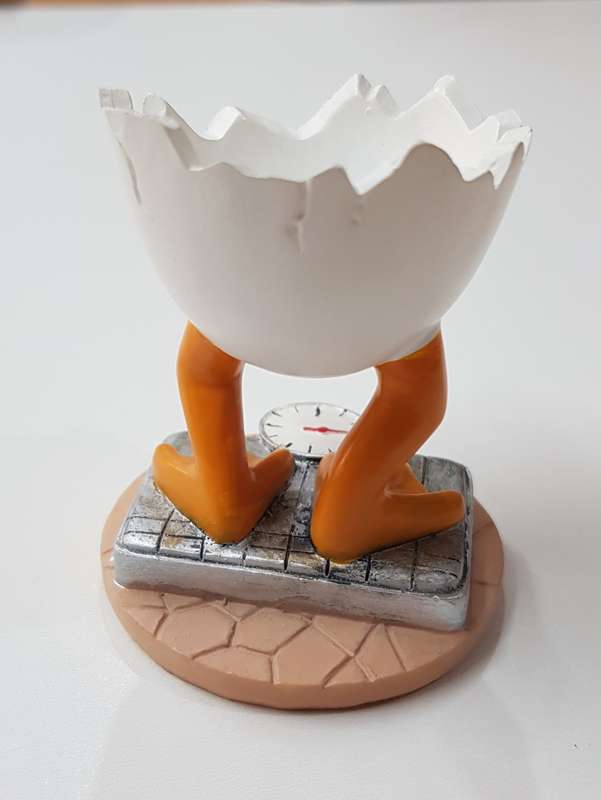 Novelty Resin egg cup  Chick standing on scale.