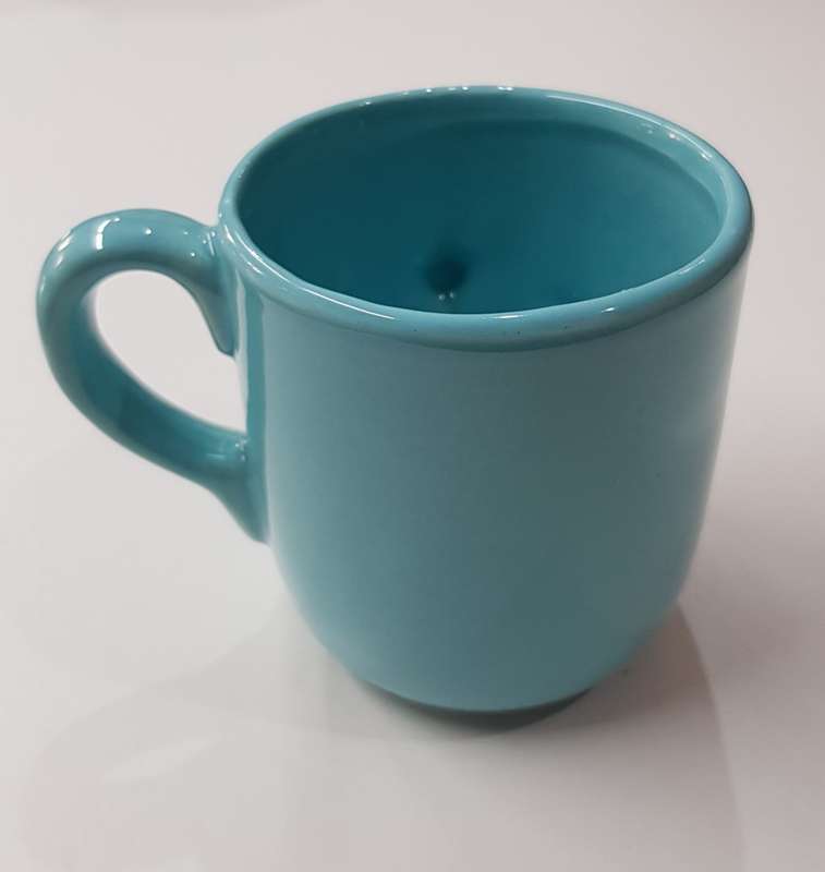 Novelty Ceramic Mug  Aqua blue mug with toes, nose and mouth